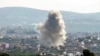 This picture taken from Lebanon's southern city of Tyre shows a cloud of smoke erupting following an Israeli air strike on the village of Sammaiyah on October 14, 2024.