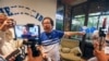 FILE - Nicaraguan journalist Miguel Mora speaks to the press after his release from prison, at his home in Managua, June 11, 2019.